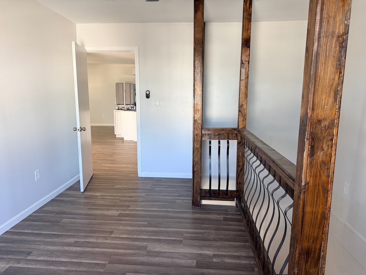 3512 Castor Street Houston, TX 77022 - Photo 20 of 24 a view of a hallway with wooden floor and staircase