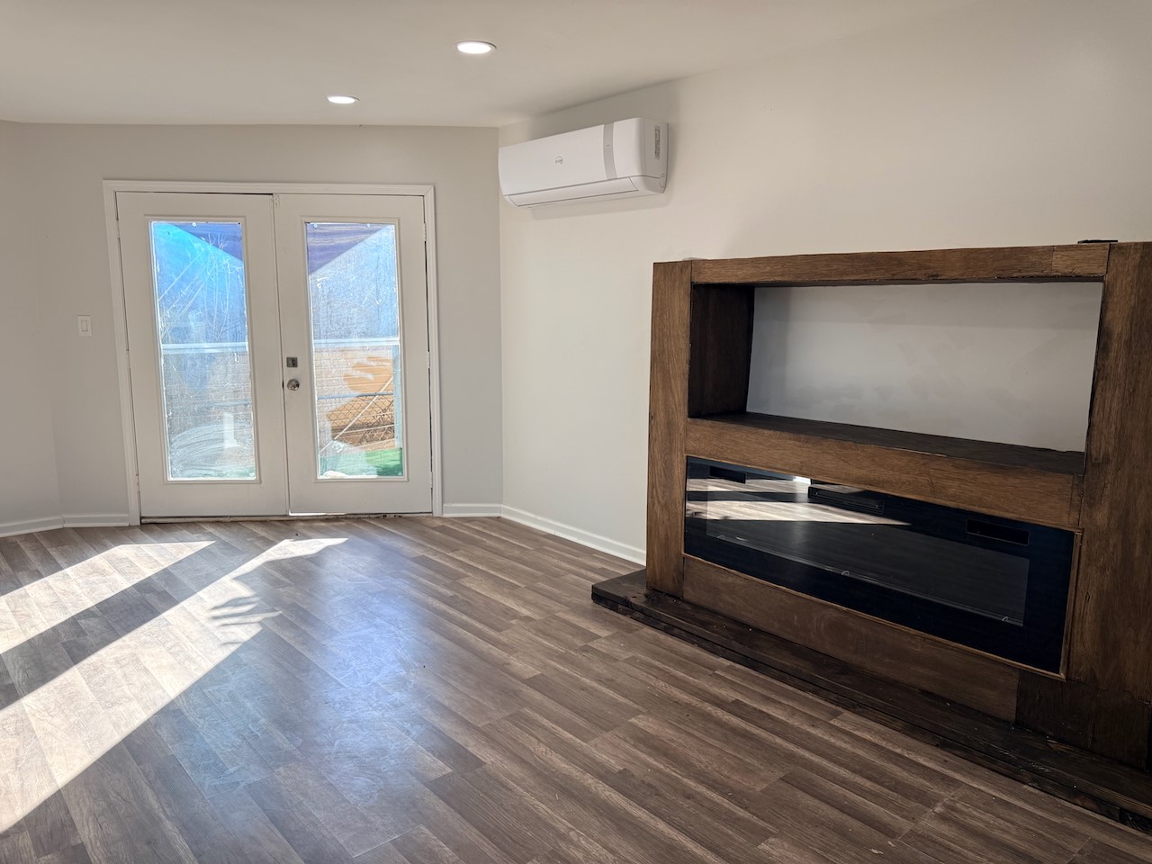 3512 Castor Street Houston, TX 77022 - Photo 4 of 24 a view of an empty room with wooden floor and a window