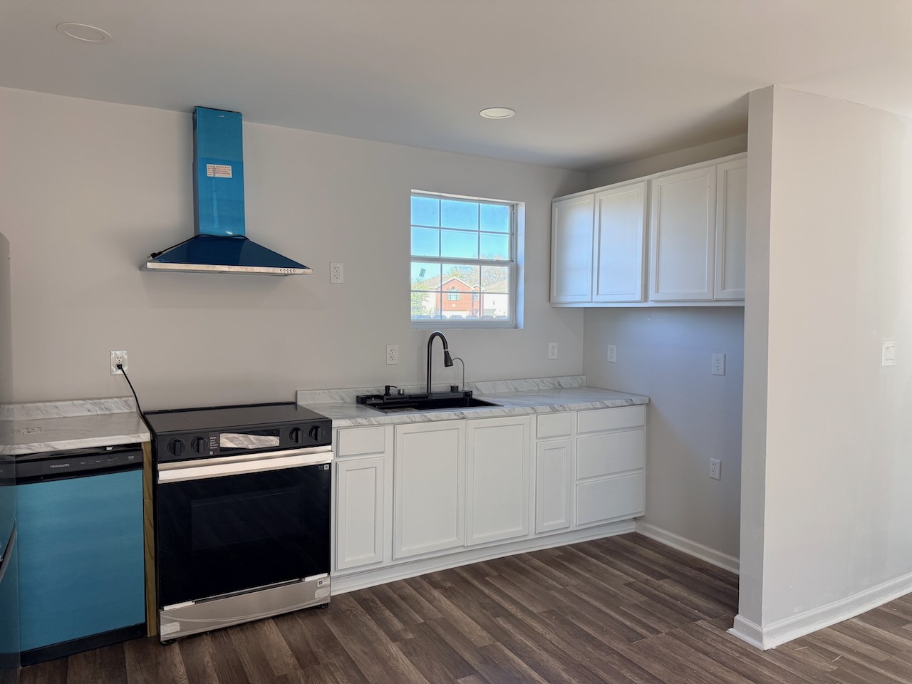 3512 Castor Street Houston, TX 77022 - Photo 7 of 24 a kitchen with a sink and a stove top oven