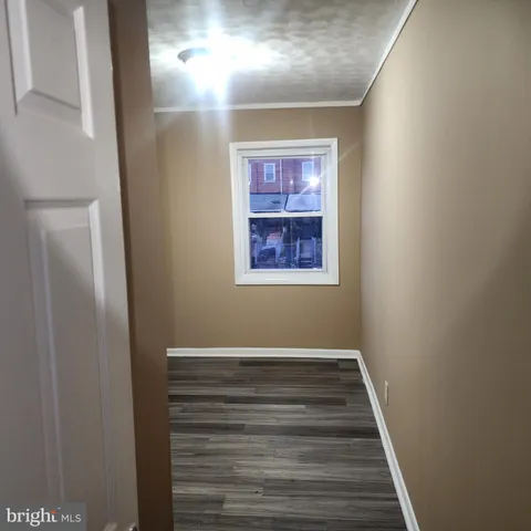 a bathroom with a toilet and bathtub