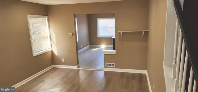 a kitchen with a refrigerator sink and cabinets