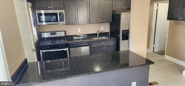 a view of room with wooden floor and window