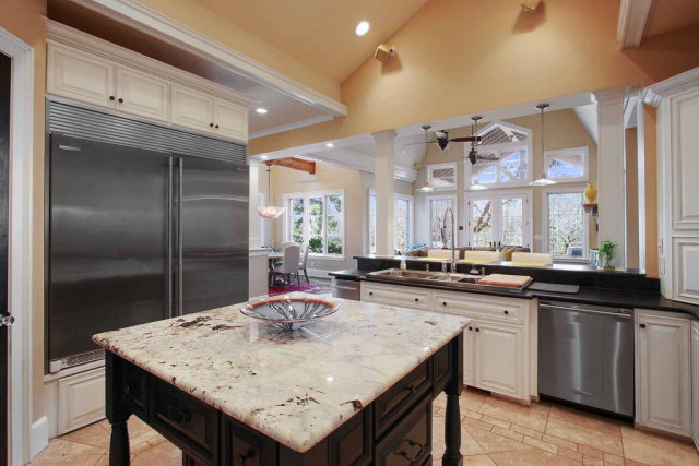5291 Arkwright Road Macon, GA 31210 - Photo 10 of 24 a kitchen with center island and stainless steel appliances