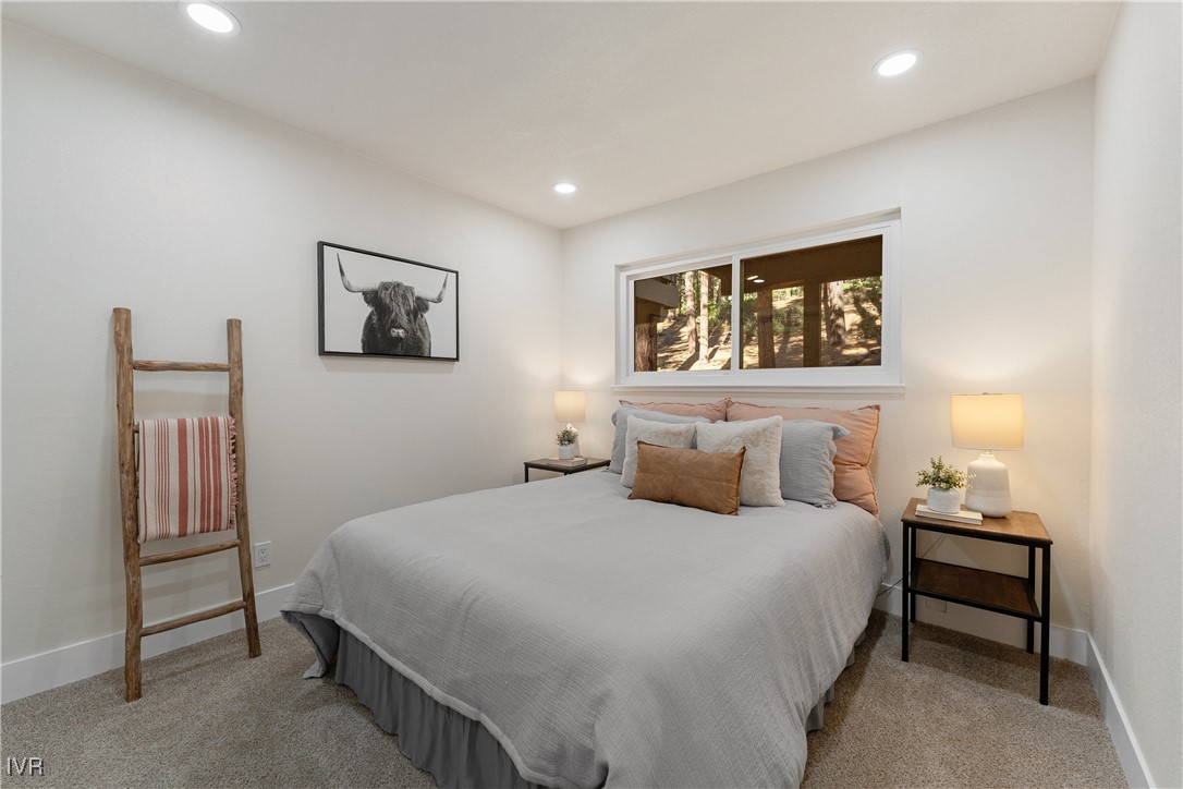 321 Ski Way, Unit 16 Incline Village, NV 89451 - Photo 15 of 23 a bedroom with a bed and a painting on the wall