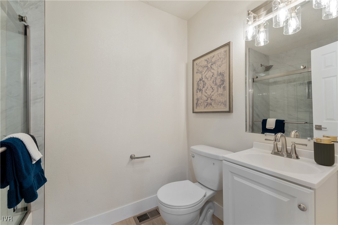 321 Ski Way, Unit 16 Incline Village, NV 89451 - Photo 17 of 23 a bathroom with a toilet sink and mirror