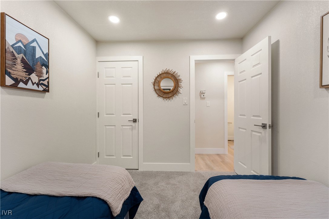 321 Ski Way, Unit 16 Incline Village, NV 89451 - Photo 19 of 23 a bedroom with a bed and a painting on the wall