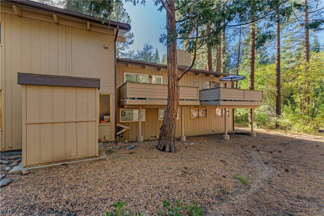 321 Ski Way, Unit 16 Incline Village, NV 89451 - Photo 23 of 23 a backyard of a house with barbeque oven table and chairs