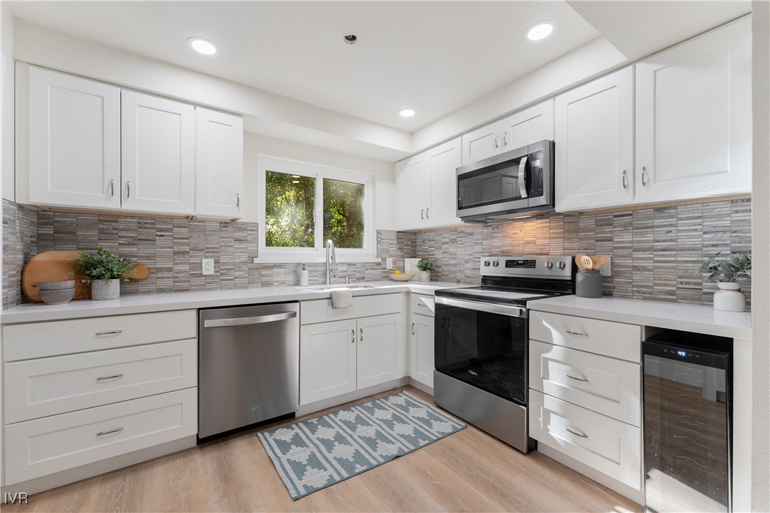 321 Ski Way, Unit 16 Incline Village, NV 89451 - Photo 6 of 23 a kitchen with granite countertop cabinets stainless steel appliances and a window