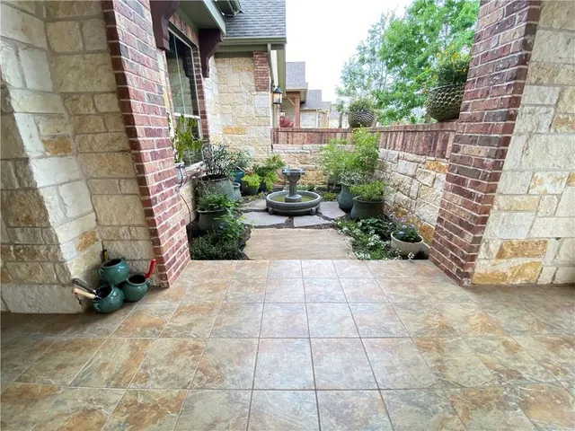 a view of a pathway with a patio