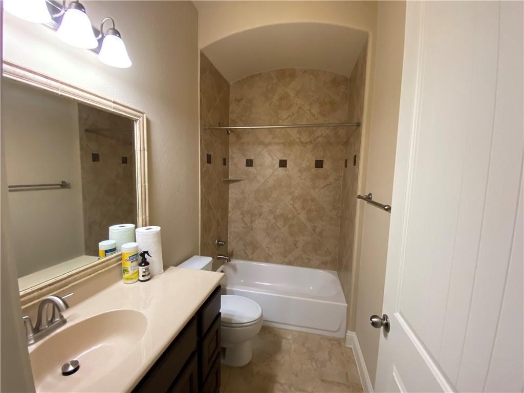 3216 Herradura Drive Cedar Park, TX 78641 - Photo 16 of 35 a bathroom with a sink a toilet and shower