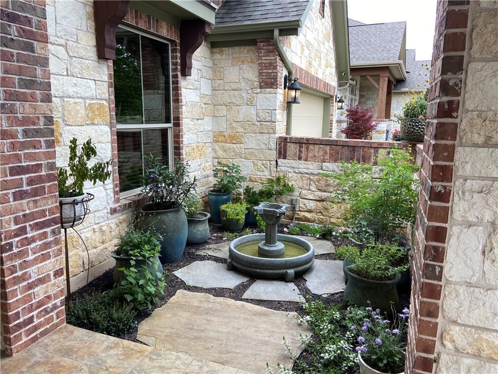 3216 Herradura Drive Cedar Park, TX 78641 - Photo 17 of 35 a view of a backyard with sitting area and plants