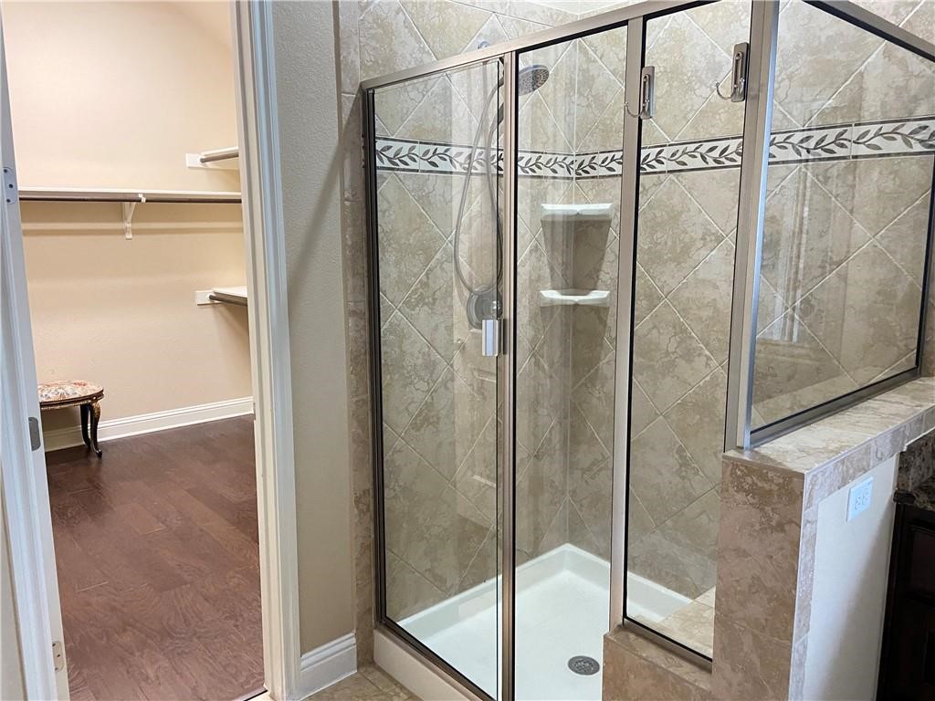3216 Herradura Drive Cedar Park, TX 78641 - Photo 20 of 35 a bathroom with a glass shower door