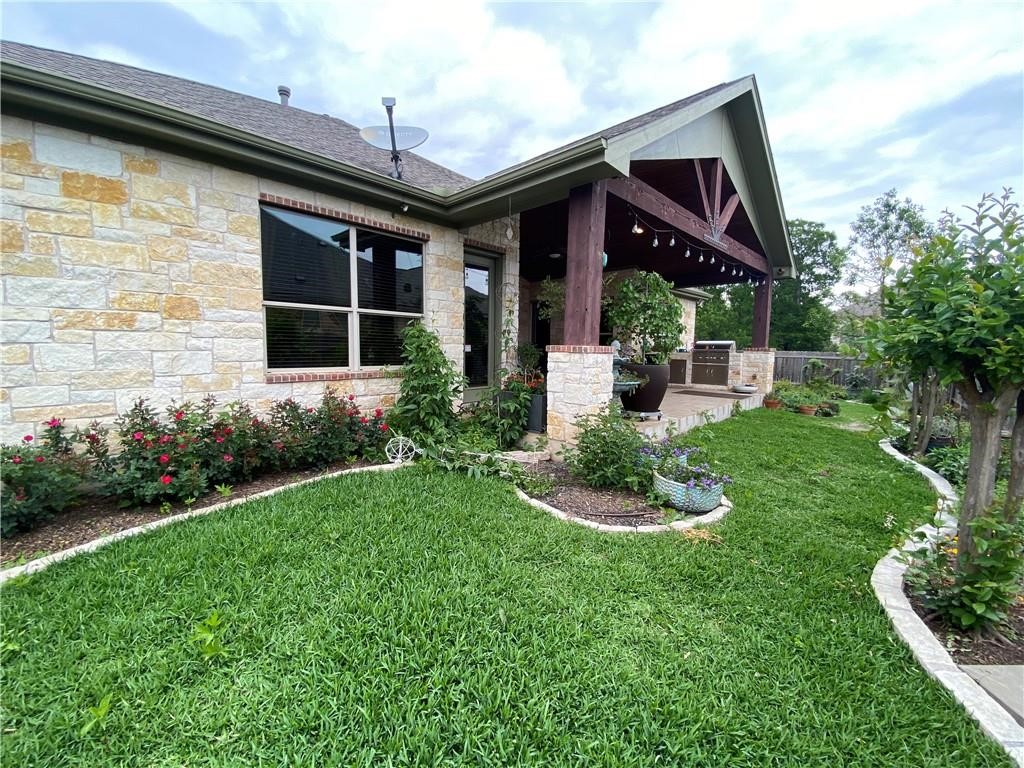3216 Herradura Drive Cedar Park, TX 78641 - Photo 26 of 35 a front view of a house with a yard table and chairs