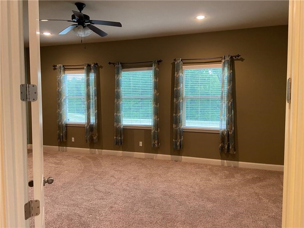 3216 Herradura Drive Cedar Park, TX 78641 - Photo 35 of 35 a view of an empty room with a fireplace and a window