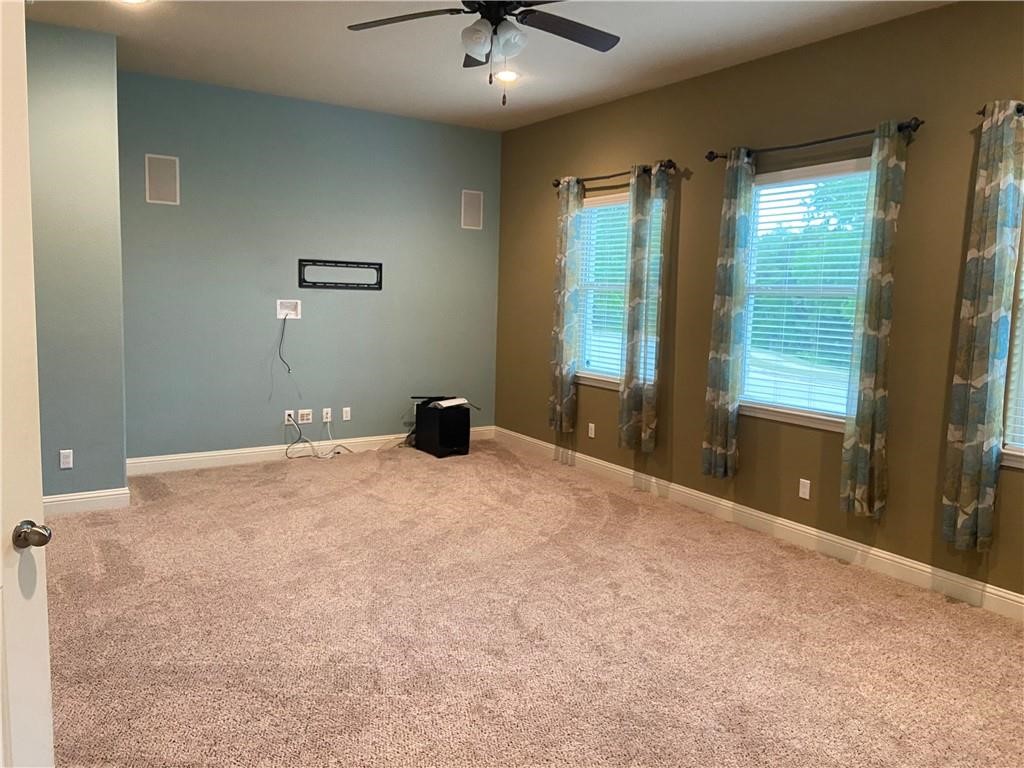 3216 Herradura Drive Cedar Park, TX 78641 - Photo 10 of 35 a bedroom with a bed and a chandelier