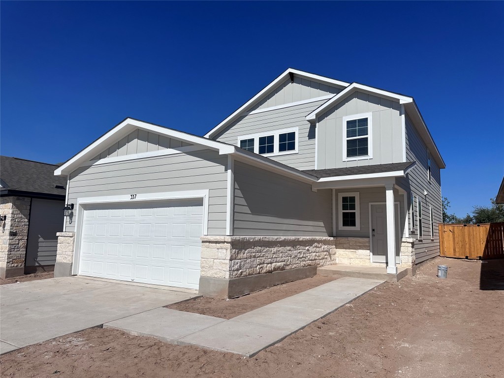 a front view of a house with a garage
