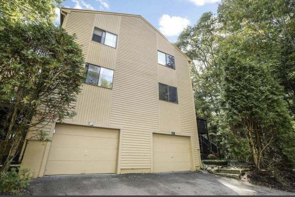 a view of a house with a tree