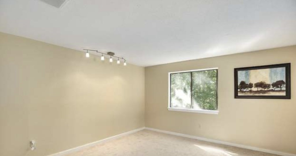 87 Meeting House Path, Unit 87 Ashland, MA 01721 - Photo 13 of 27 a view of an empty room with a window