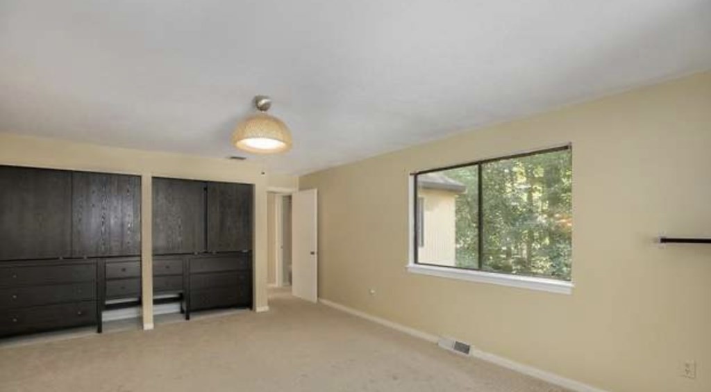 87 Meeting House Path, Unit 87 Ashland, MA 01721 - Photo 15 of 27 a view of an empty room with a window