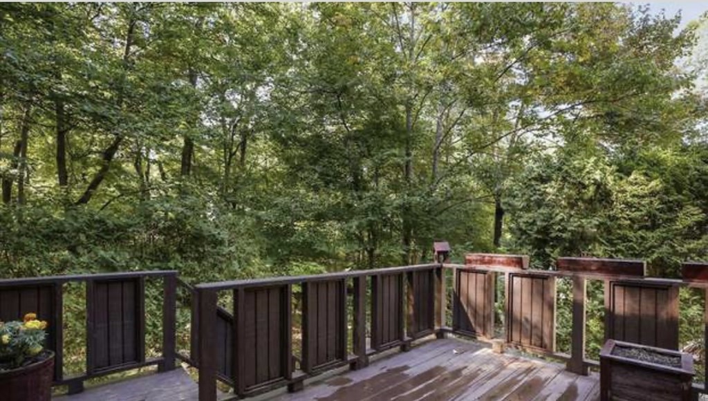 87 Meeting House Path, Unit 87 Ashland, MA 01721 - Photo 19 of 27 a wooden deck with trees in front of it