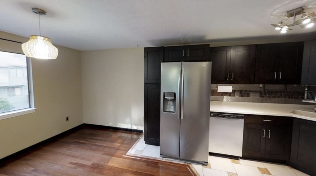 87 Meeting House Path, Unit 87 Ashland, MA 01721 - Photo 2 of 27 a kitchen with stainless steel appliances granite countertop a refrigerator and a sink
