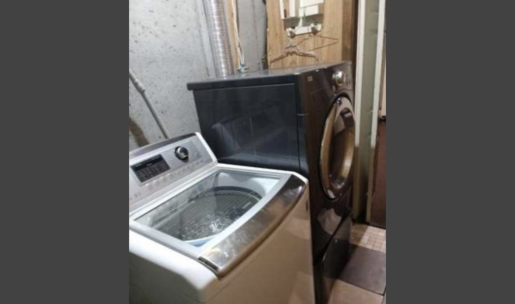 87 Meeting House Path, Unit 87 Ashland, MA 01721 - Photo 22 of 27 a bathroom with a sink and washing machine