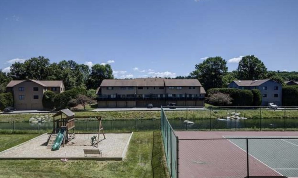 87 Meeting House Path, Unit 87 Ashland, MA 01721 - Photo 26 of 27 a swimming pool with outdoor seating and yard