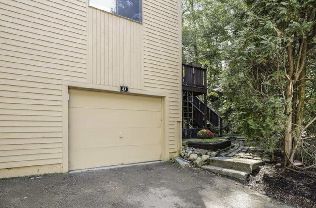 87 Meeting House Path, Unit 87 Ashland, MA 01721 - Photo 3 of 27 a view of a house with a garage