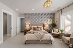 1141 East Lost Ridge Drive Washington, UT 84780 - Photo 96 of 108 Carpeted room featuring a patterned accent wall, a tufted headboard, and a contemporary chandelier