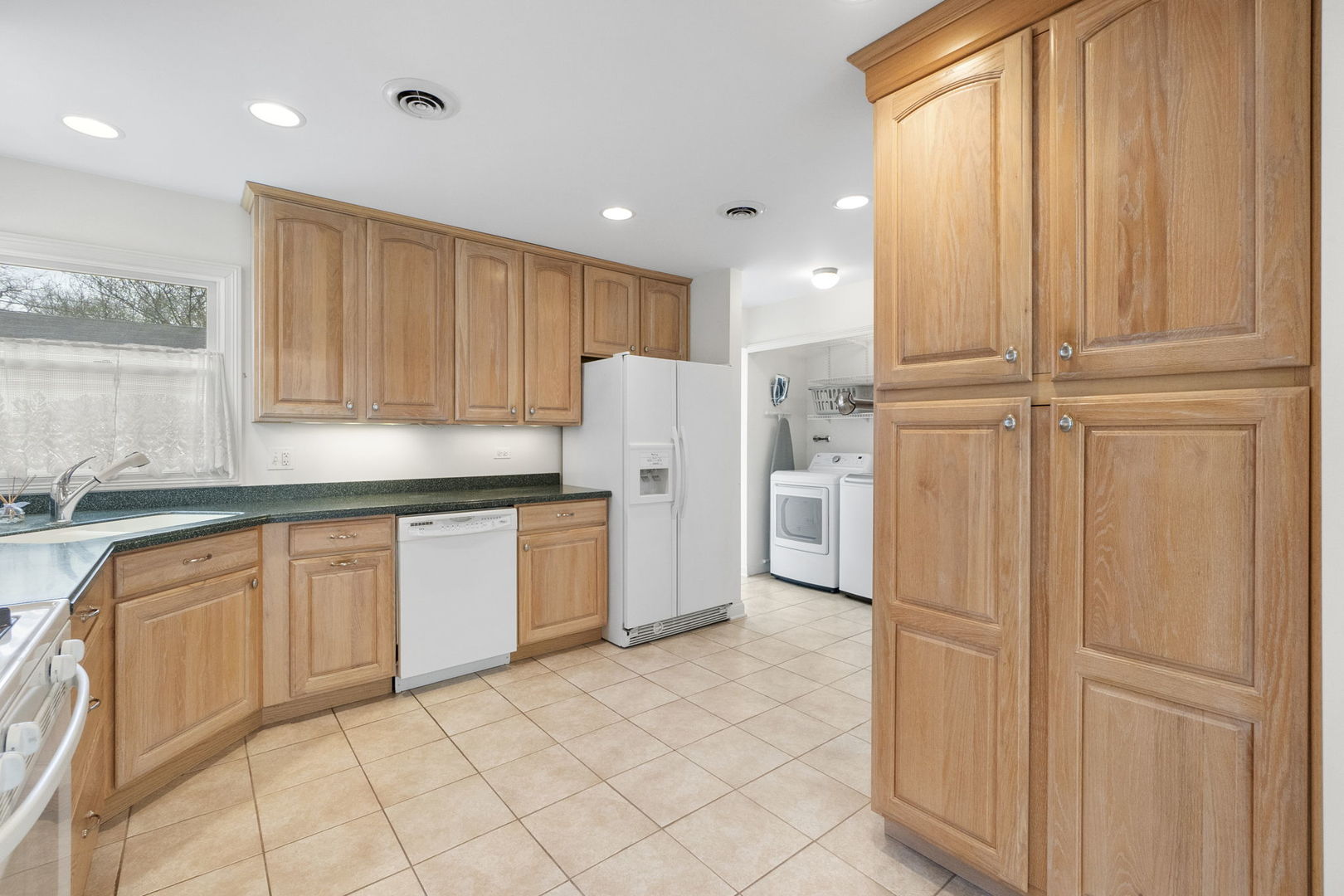 837 East Rockland Road Libertyville, IL 60048 - Photo 14 of 17 a kitchen with granite countertop cabinets and refrigerator