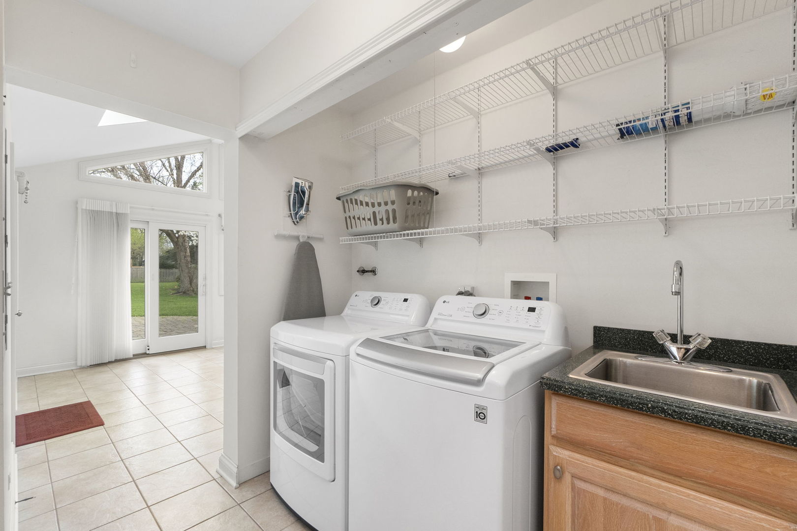 837 East Rockland Road Libertyville, IL 60048 - Photo 15 of 17 a utility room with sink dryer and washer