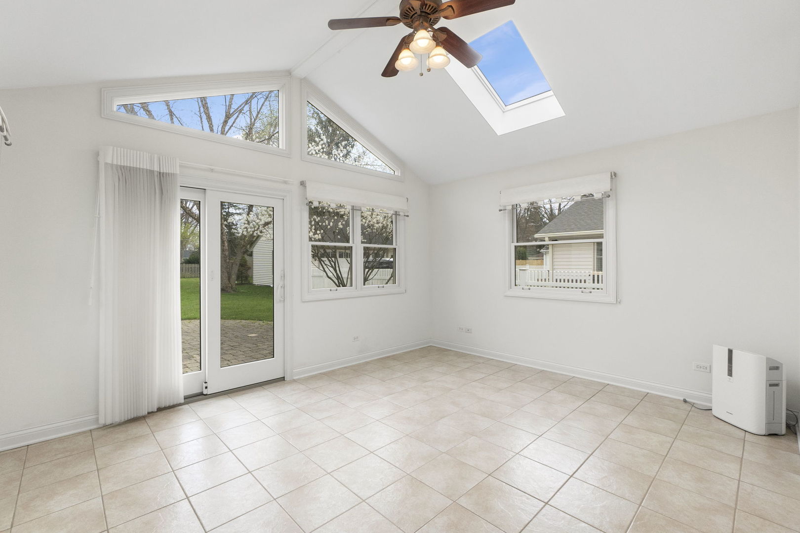 837 East Rockland Road Libertyville, IL 60048 - Photo 3 of 17 a view of an empty room with a window