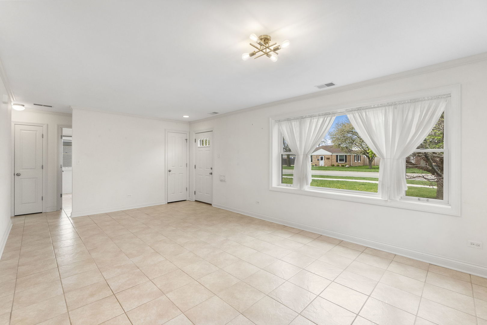 837 East Rockland Road Libertyville, IL 60048 - Photo 5 of 17 wooden floor in an empty room with a window