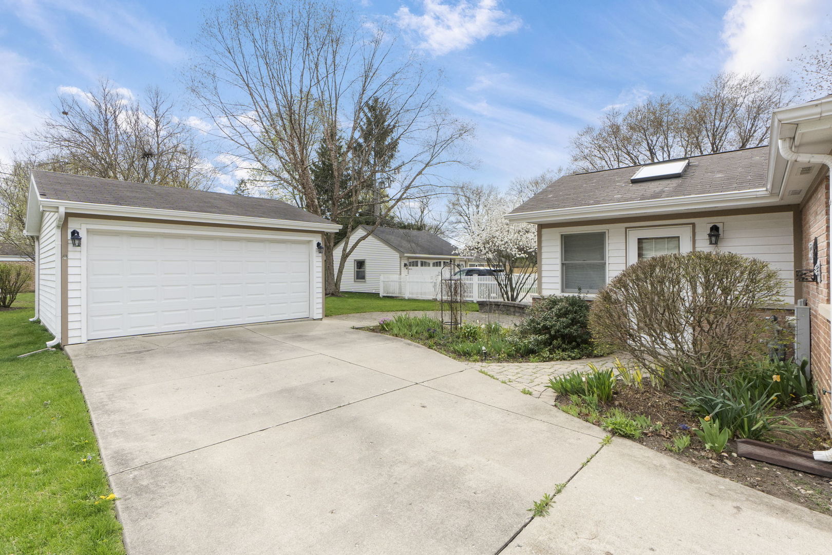 837 East Rockland Road Libertyville, IL 60048 - Photo 9 of 17 a front view of a house with a yard and garage