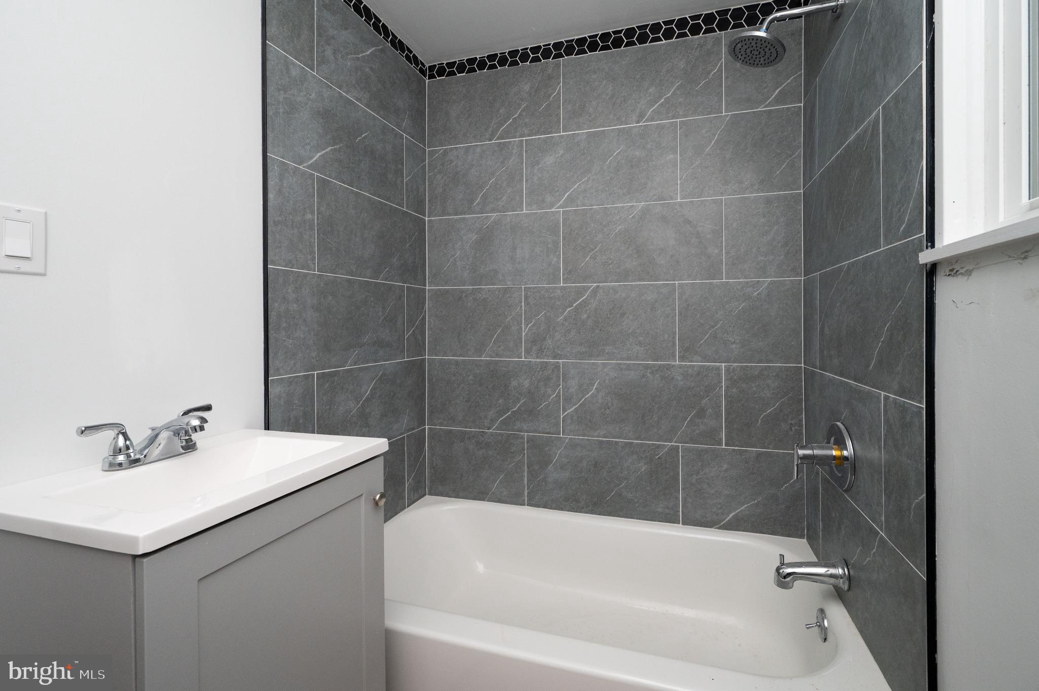 620 Minor Street Reading, PA 19602 - Photo 30 of 36 a white bath tub sitting next to a white sink