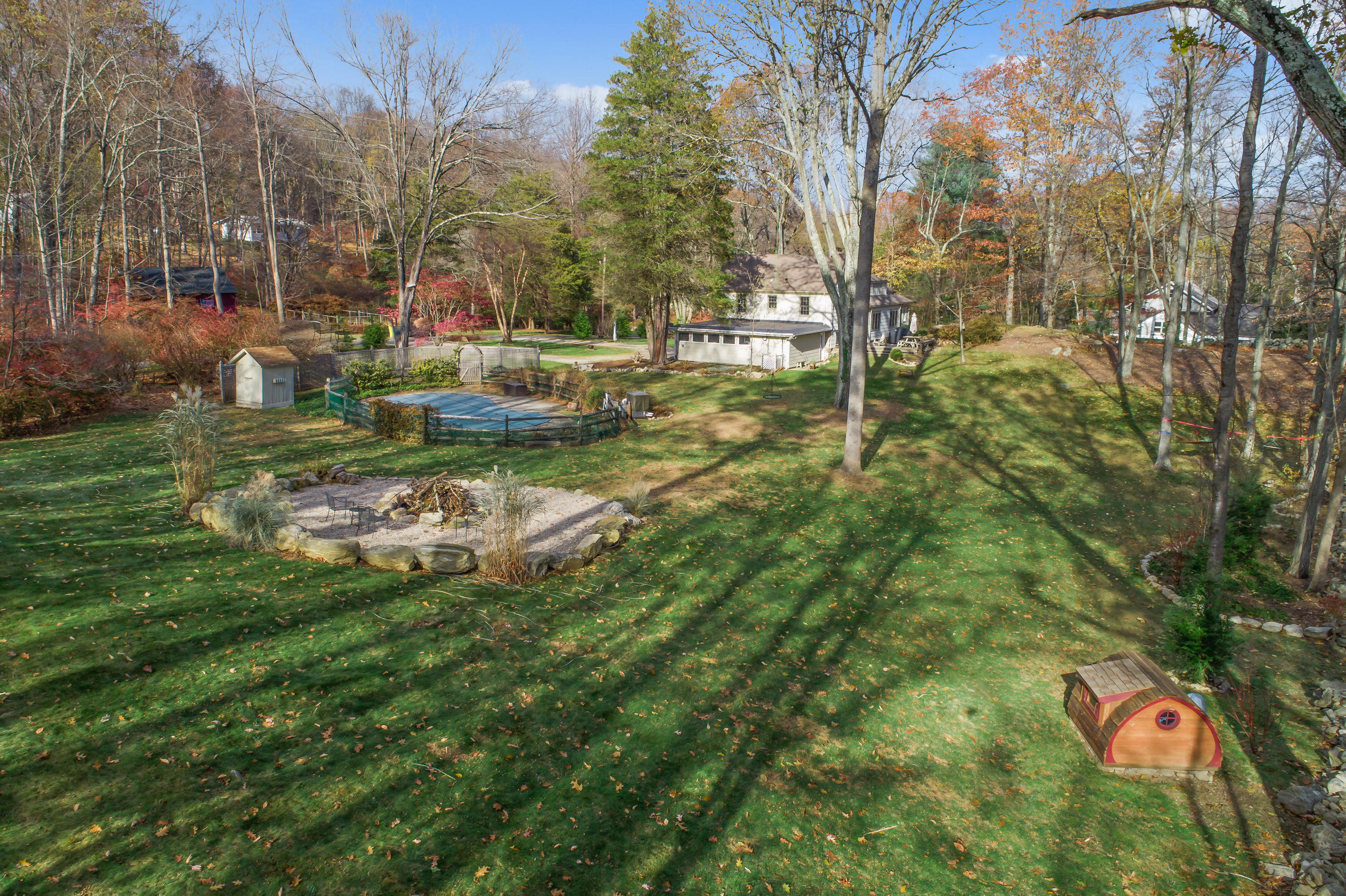 13 Hidden Hill Road Weston, CT 06883 - Photo 23 of 27 Rear yard with pool and firepit