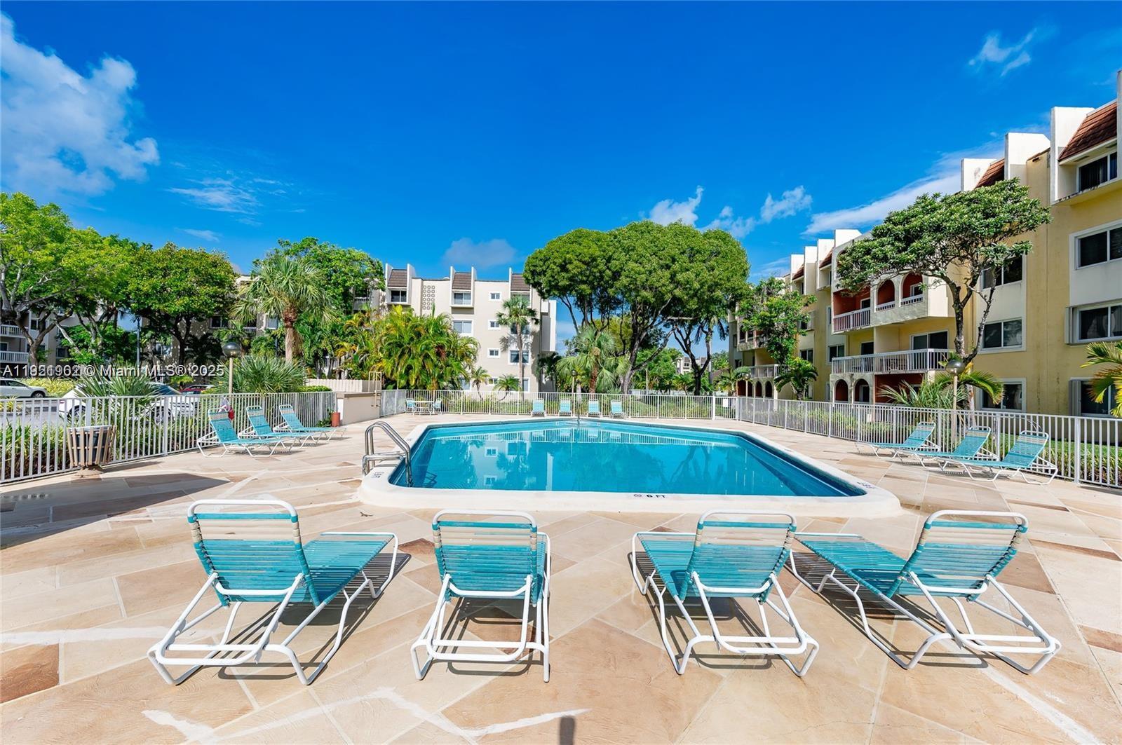 9446 Southwest 140th Court, Unit 9446 Miami, FL 33186 - Photo 15 of 48 a view of an chairs and tables in the patio