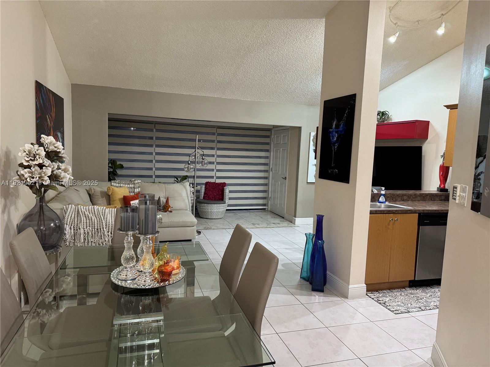 9446 Southwest 140th Court, Unit 9446 Miami, FL 33186 - Photo 21 of 48 a view of a dining room with furniture