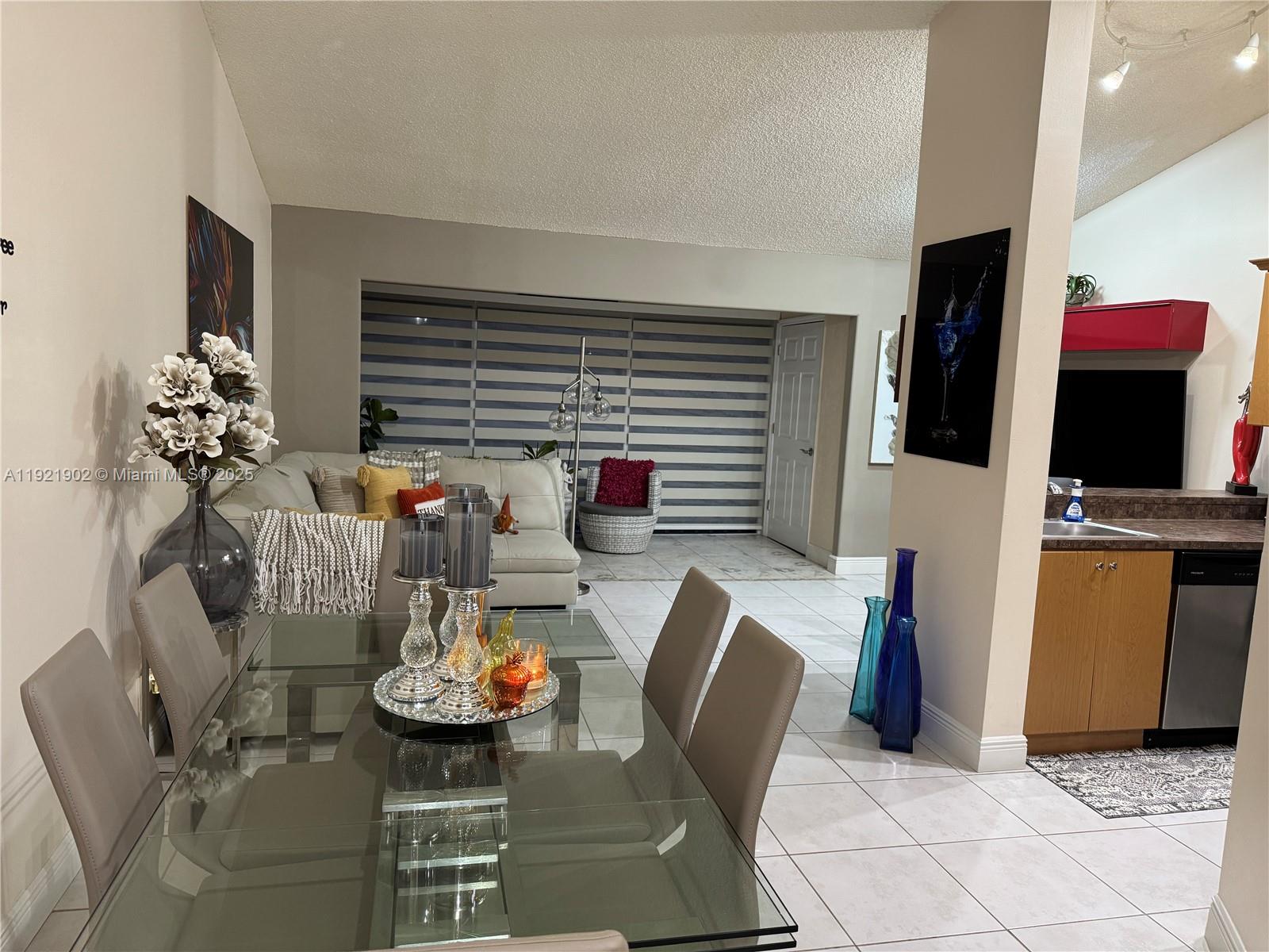 9446 Southwest 140th Court, Unit 9446 Miami, FL 33186 - Photo 22 of 48 a dining room with furniture and wooden floor