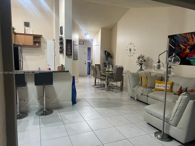 a kitchen with a sink stove and refrigerator