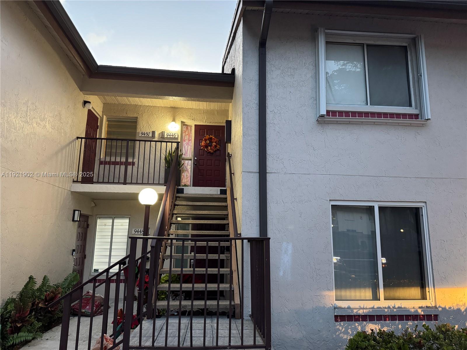 9446 Southwest 140th Court, Unit 9446 Miami, FL 33186 - Photo 30 of 48 a view of entryway and hall with wooden floor