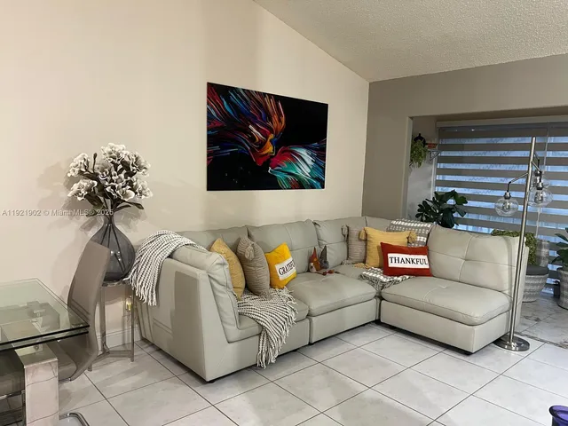 a living room with furniture and a rug