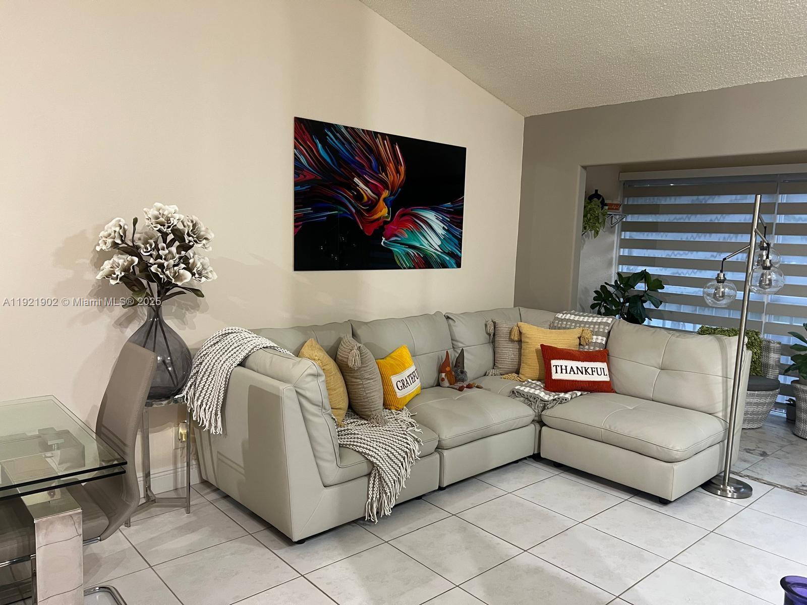 9446 Southwest 140th Court, Unit 9446 Miami, FL 33186 - Photo 3 of 48 a living room with furniture and a rug