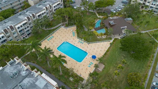 a front view of a house with yard and green space