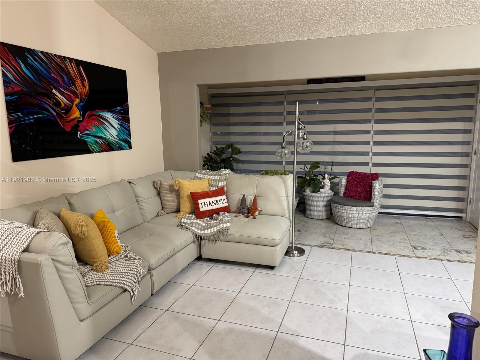 9446 Southwest 140th Court, Unit 9446 Miami, FL 33186 - Photo 36 of 48 a living room with furniture and a window