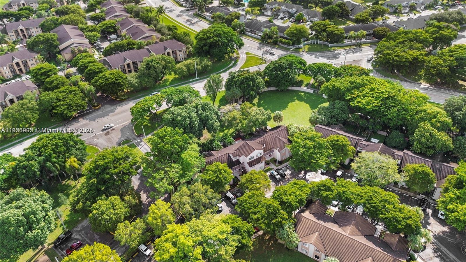 9446 Southwest 140th Court, Unit 9446 Miami, FL 33186 - Photo 38 of 48 an aerial view of a house with a yard lake and lake view