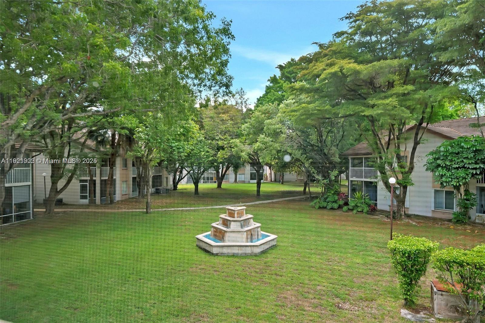 9446 Southwest 140th Court, Unit 9446 Miami, FL 33186 - Photo 43 of 48 a view of a park with large trees