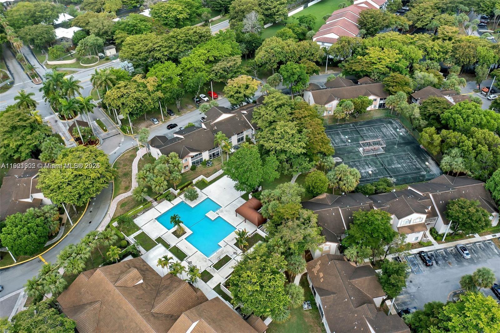 9446 Southwest 140th Court, Unit 9446 Miami, FL 33186 - Photo 44 of 48 an aerial view of residential house with outdoor space and trees all around