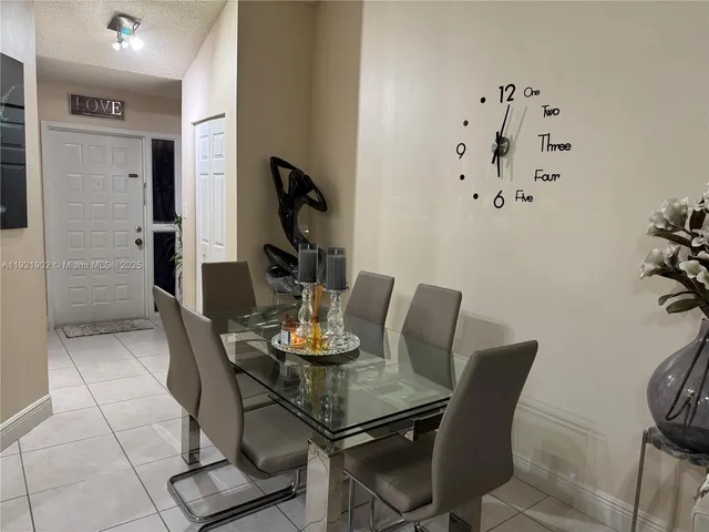 a kitchen with stainless steel appliances granite countertop a refrigerator and stove