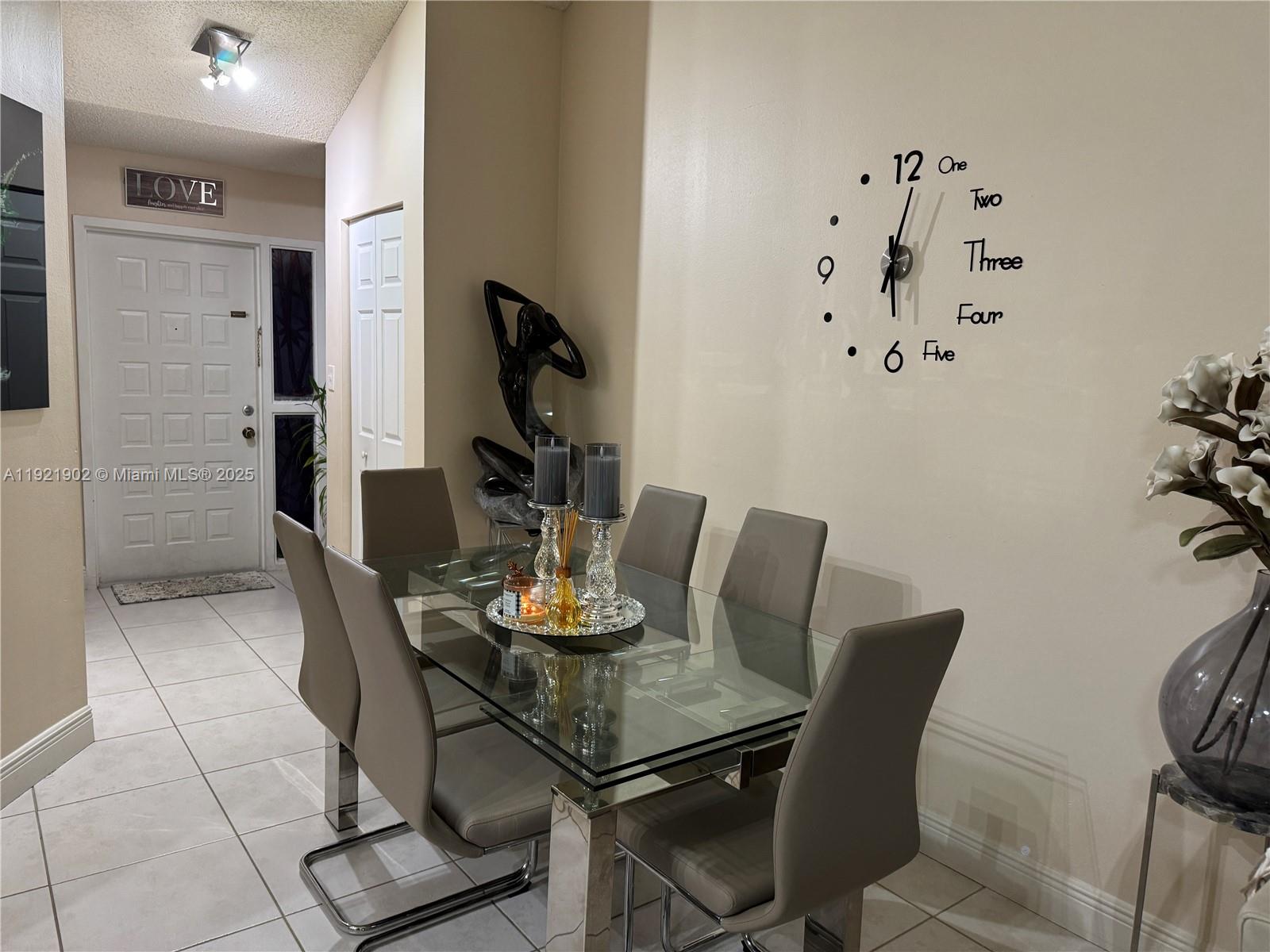 9446 Southwest 140th Court, Unit 9446 Miami, FL 33186 - Photo 6 of 48 a view of a dining room with furniture